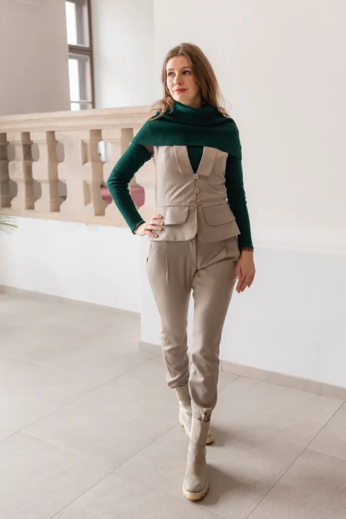 Beige outfit styled with green knit three piece set including neck warmer waist warmer and arm warmers