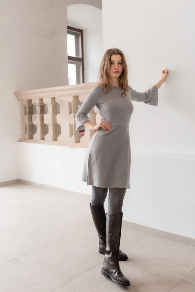 Neutral base outfit before transformation into multiple looks with knit accessories
